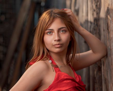 Portrait of a young woman with brown hair and piercings, posing outdoors in Tlaxcala, Mexico.