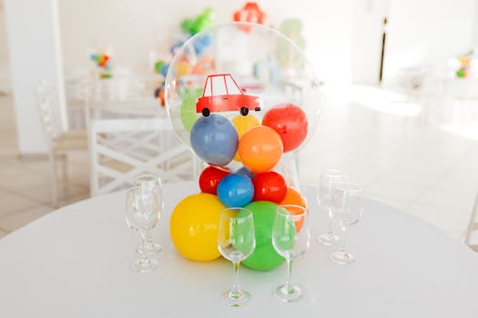 Festive kids party setup featuring colorful balloons and glassware, captured with a Canon EOS R5 camera.