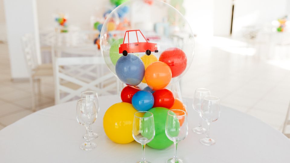 Essential celebration setup with colourful balloons and styled table