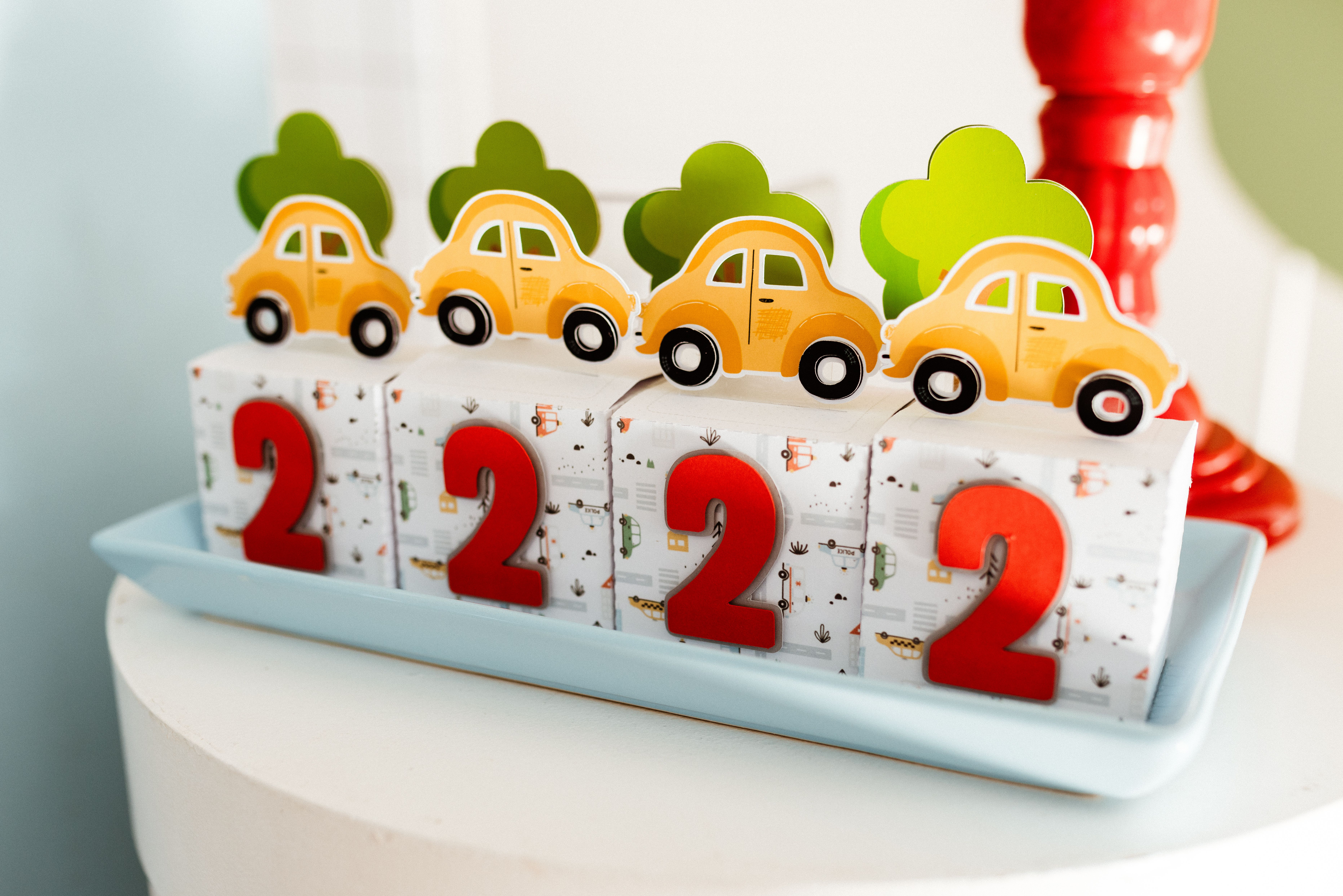 bespoke themed birthday Cairo — Decorative blocks with red numbers and yellow toy cars, perfect for children's birthday theme