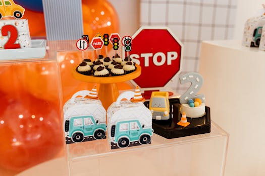 Vibrant birthday setup with traffic-themed decorations and colorful cakes.