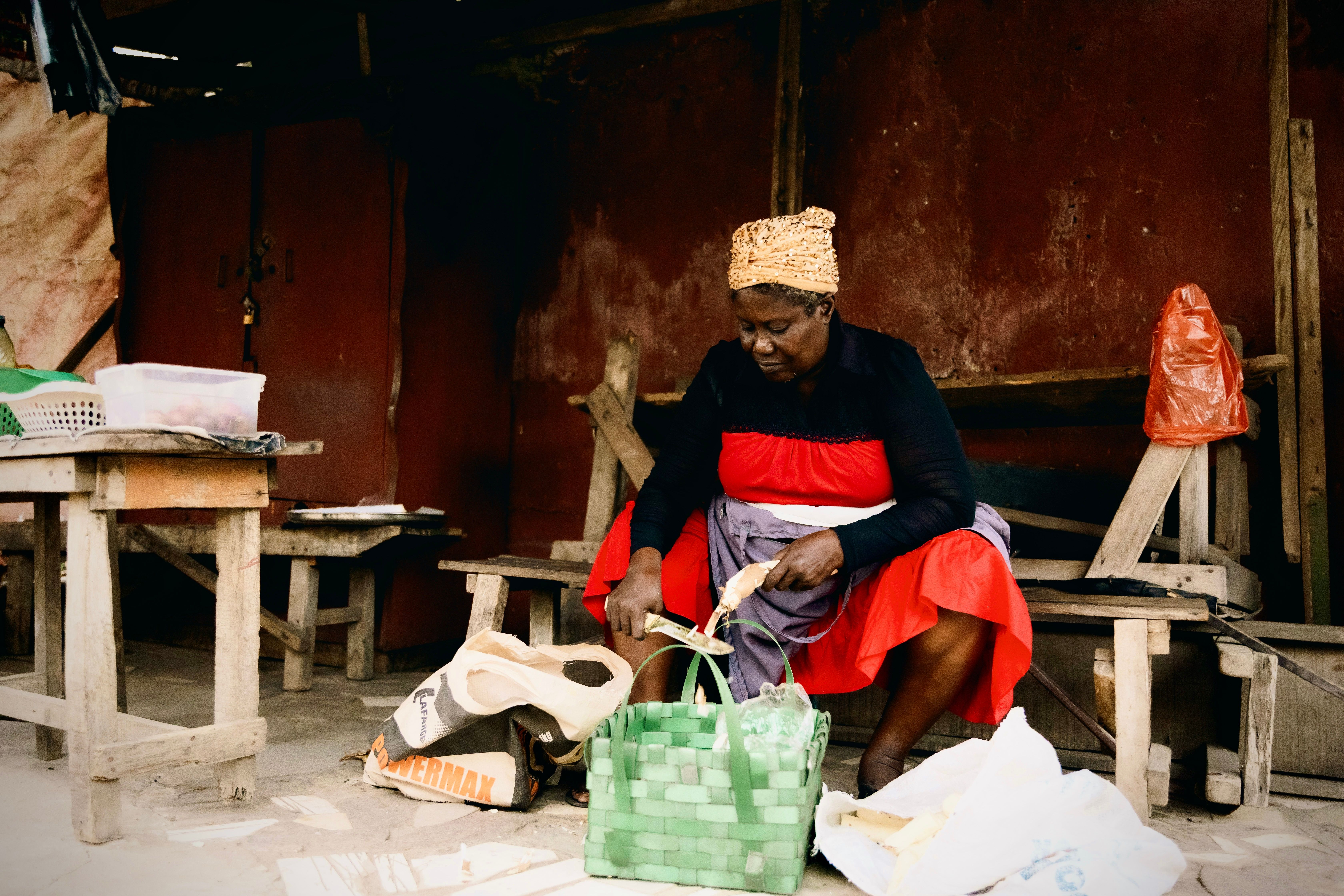 a woman peeling garden eggs in a bright kitchen in the Volta Region
