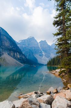 Breathtaking landscape of Moraine Lake with turquoise waters and Rocky Mountains in Banff National Park, Canada.