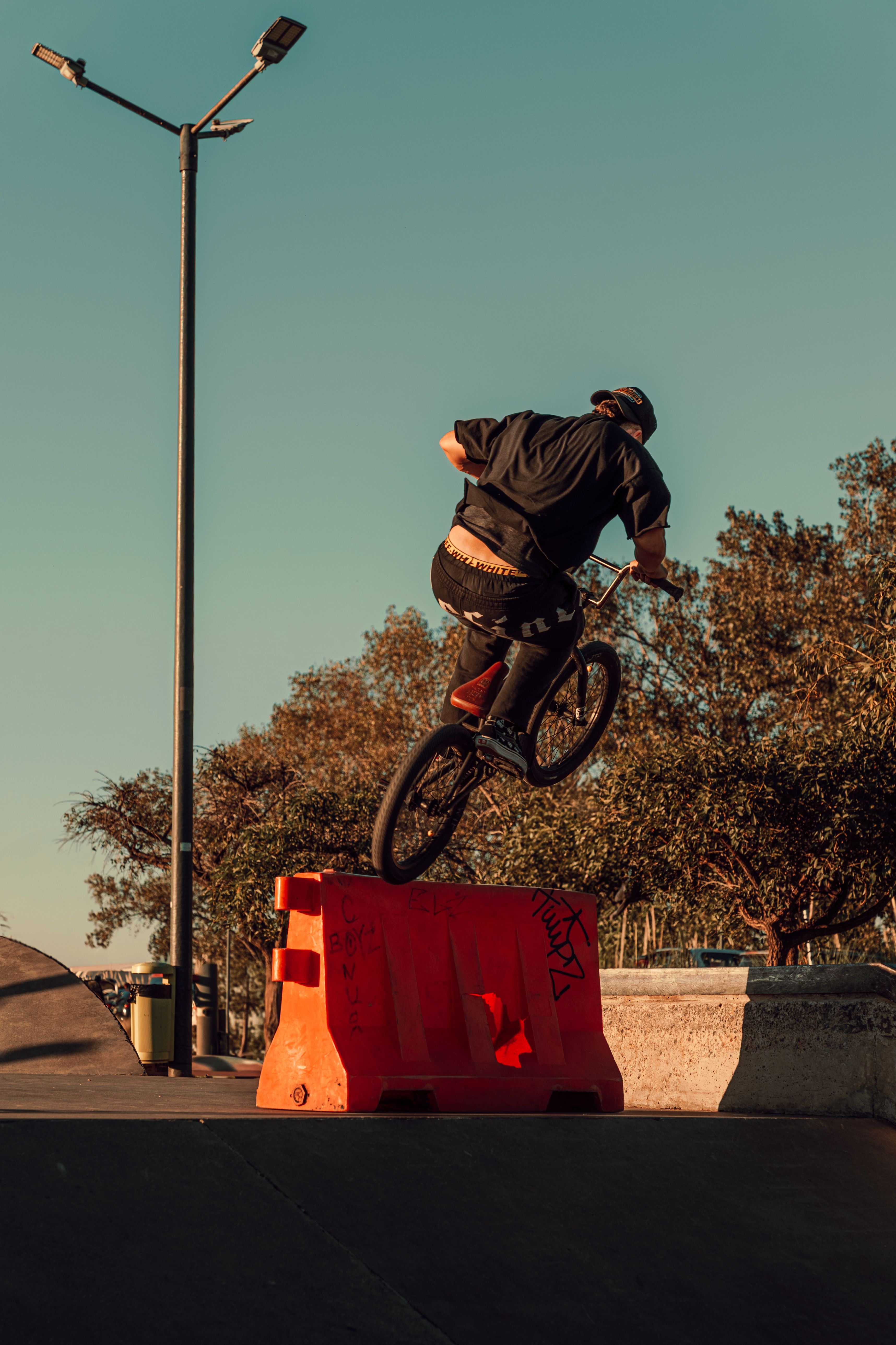 BMX Rider Performing Jump at Skate Park · Free Stock Photo