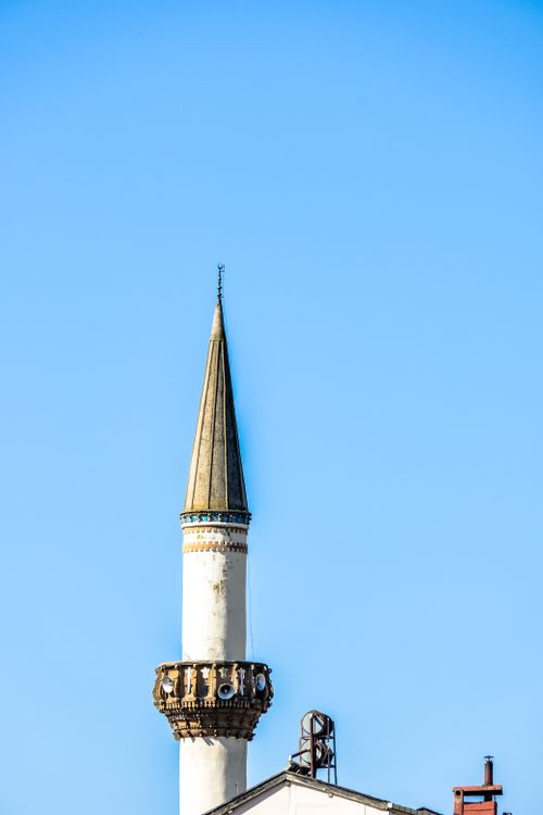 Free A stunning mosque minaret with detailed architecture under a clear blue sky, showcasing rich cultural heritage. Stock Photo