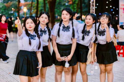 Teenage girls in school uniforms posing outdoors · Free Stock Photo