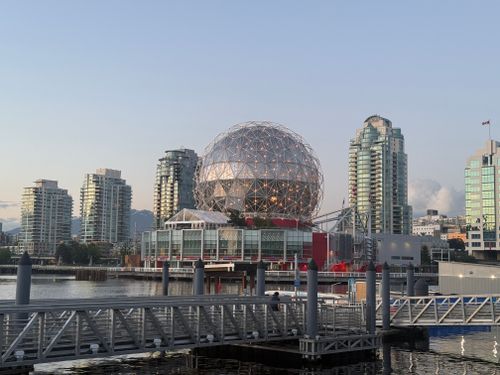Free View of Science World and modern buildings at sunset in Vancouver, BC. Stock Photo