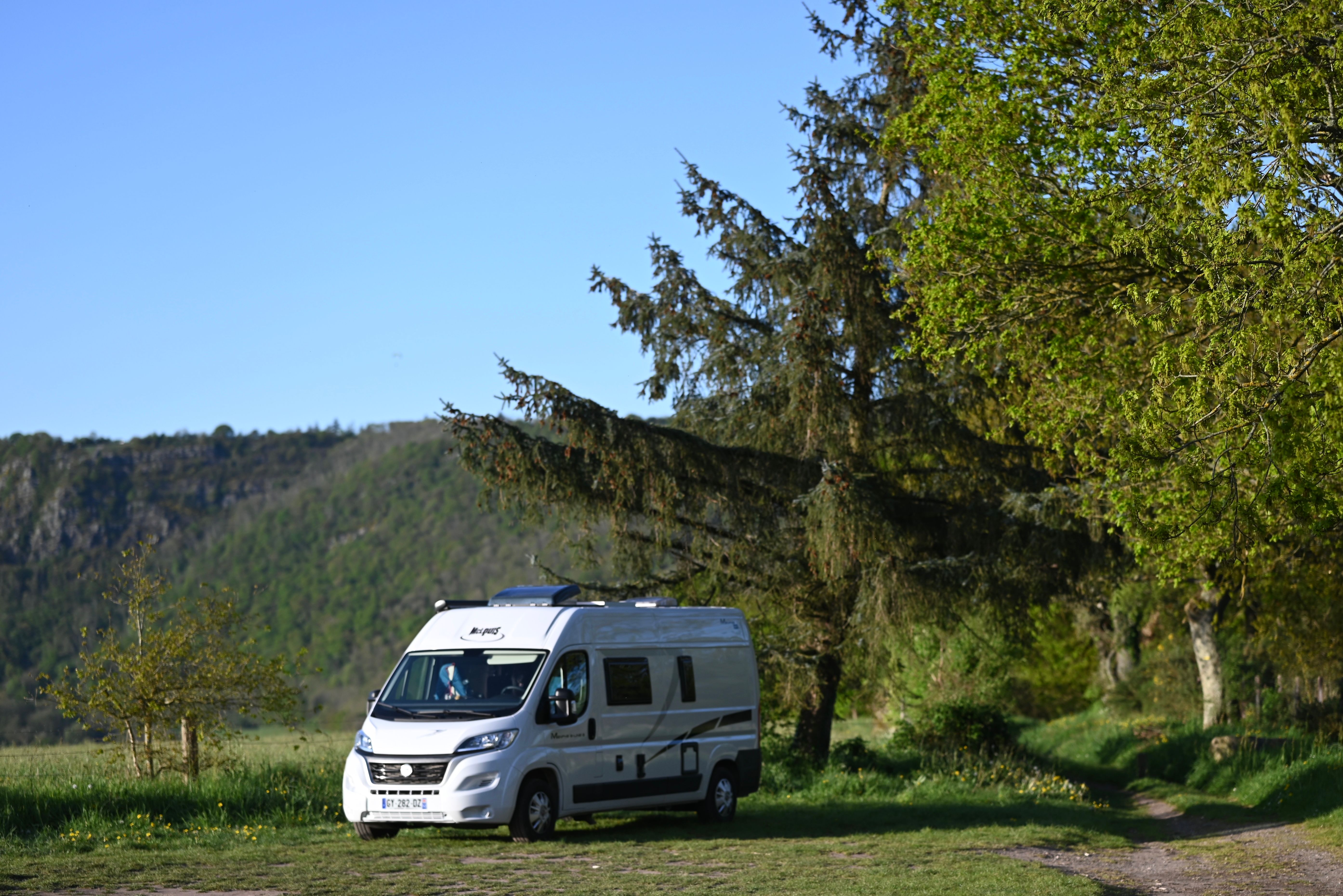 Camper Van Adventure in Scenic Nature Setting · Free Stock Photo