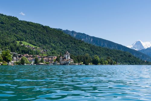 Free Discover the picturesque town of Spiez by Lake Thun with the Alps in the background, showcasing natural beauty and architecture. Stock Photo