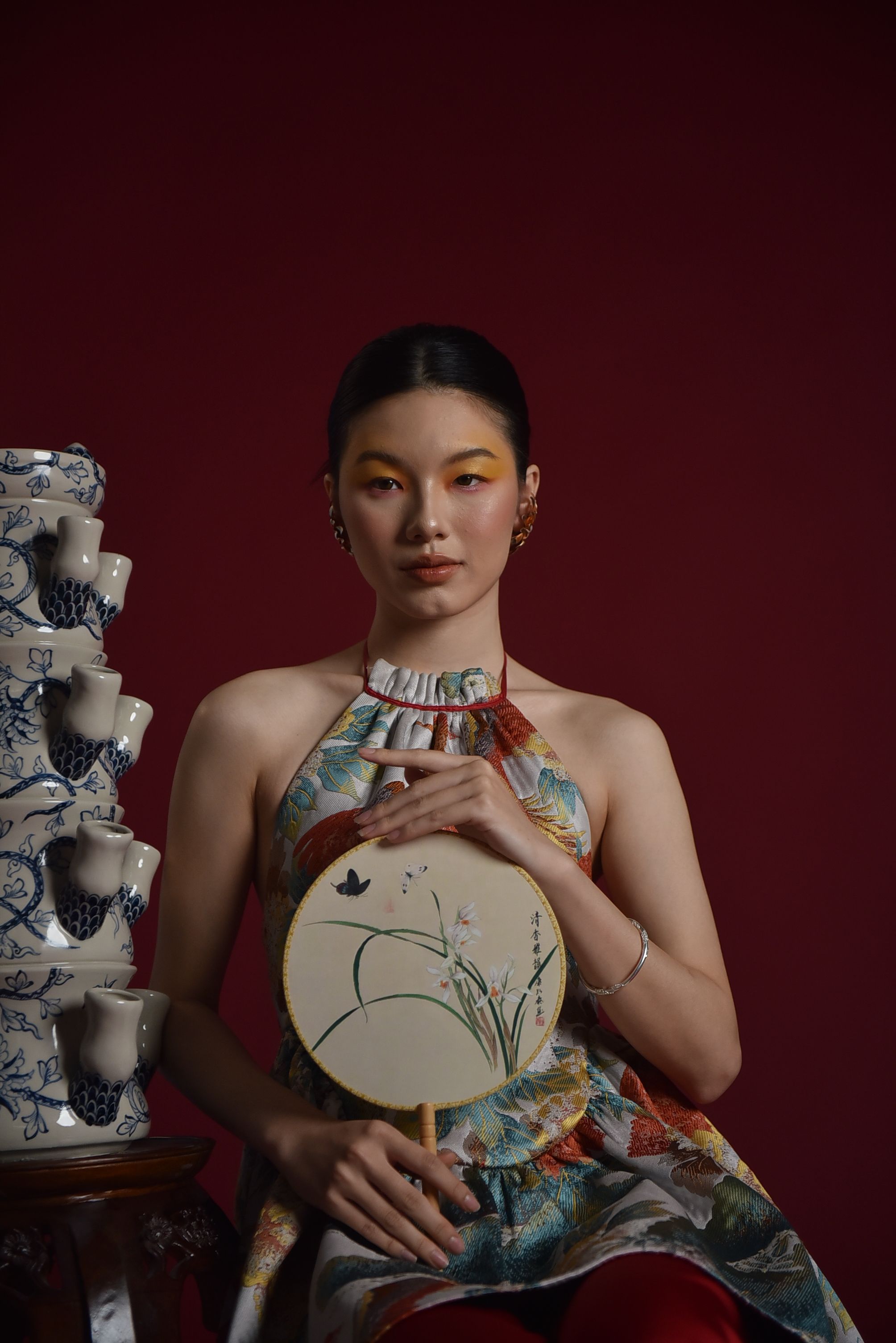 Elegant Portrait with Traditional Fan and Porcelain · Free Stock Photo