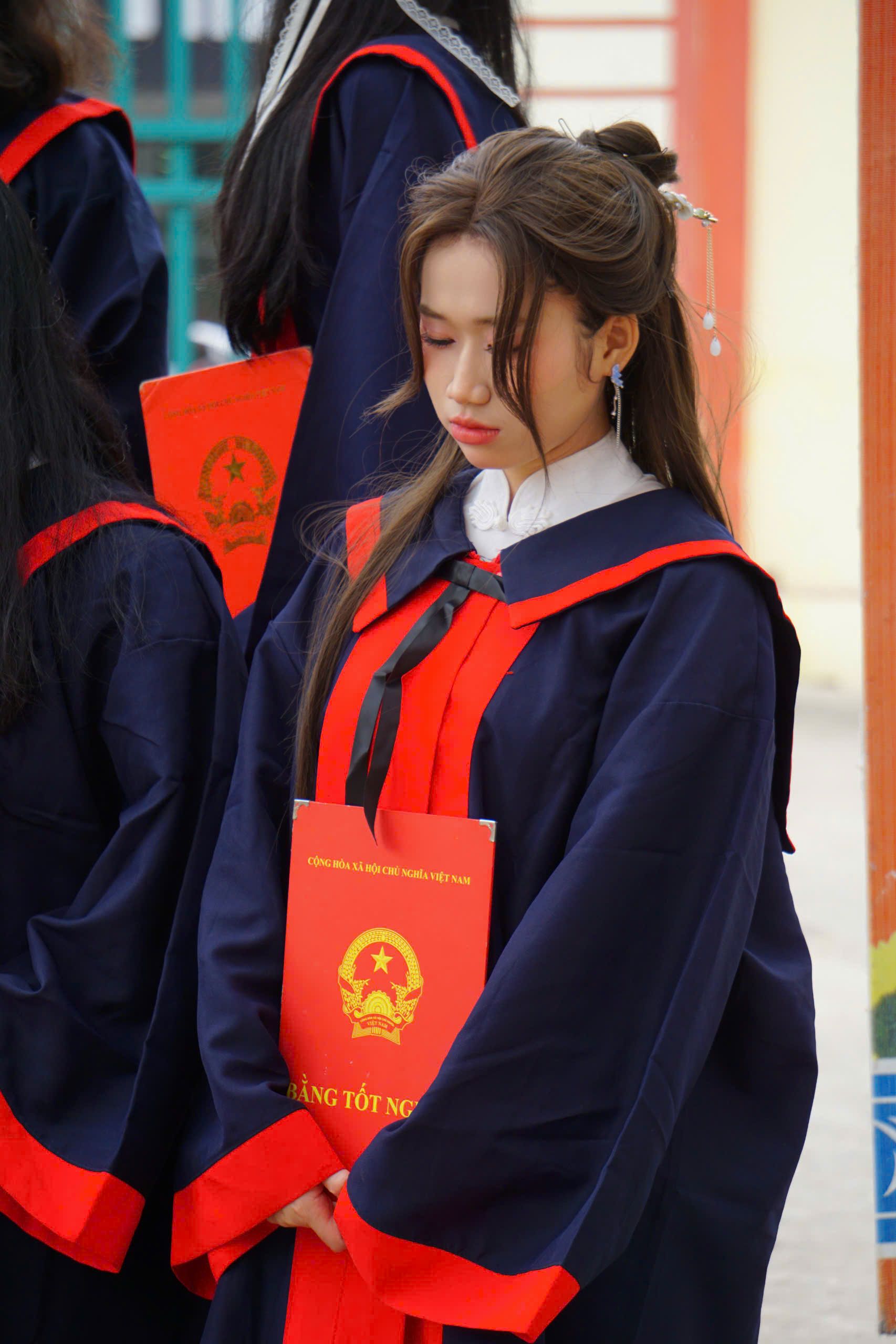 Asian Graduate in Traditional Academic Robe · Free Stock Photo