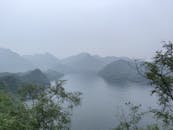 Serene Lake and Mountain View in Foggy Scenery