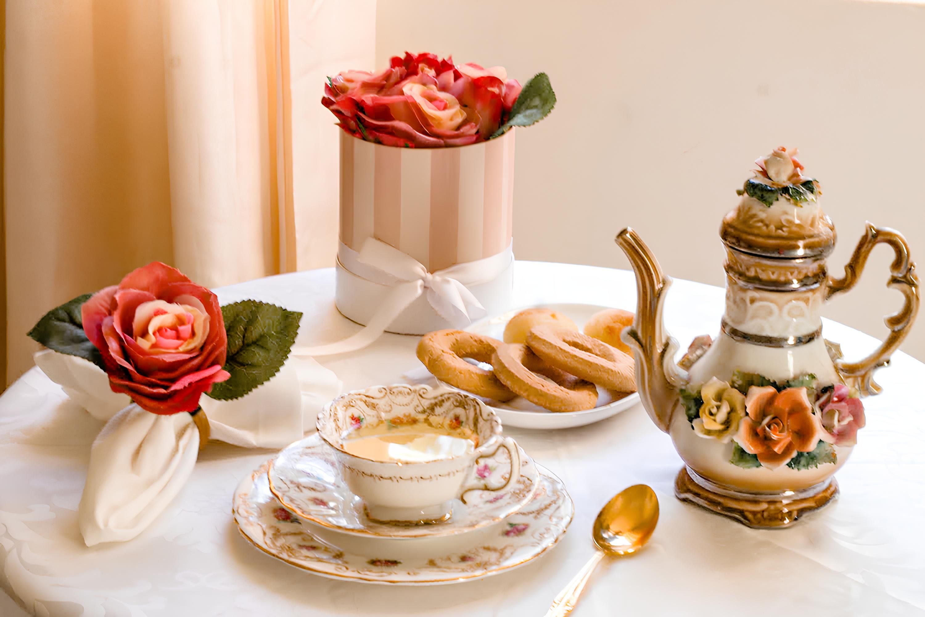 Elegant Tea Set with Roses and Pastries · Free Stock Photo