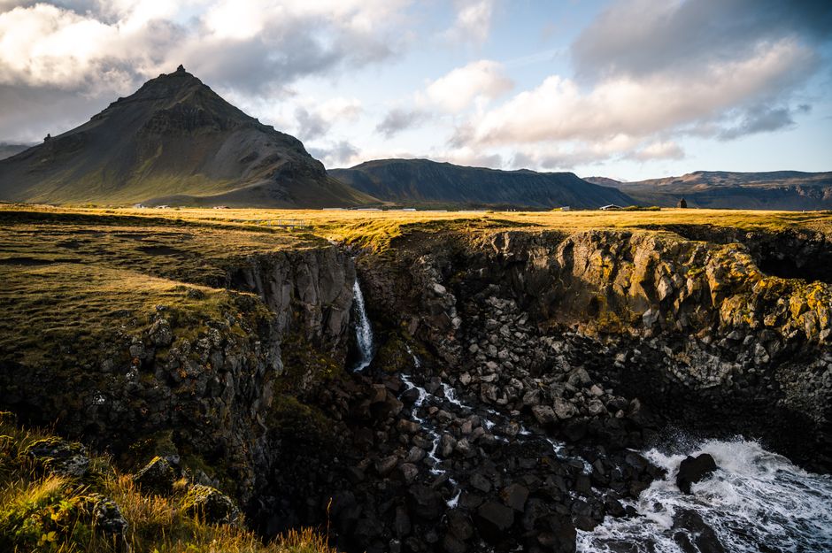Explore the breathtaking beauty of Arnarstapi, Iceland, showcasing mountains, waterfalls, and pristine nature.