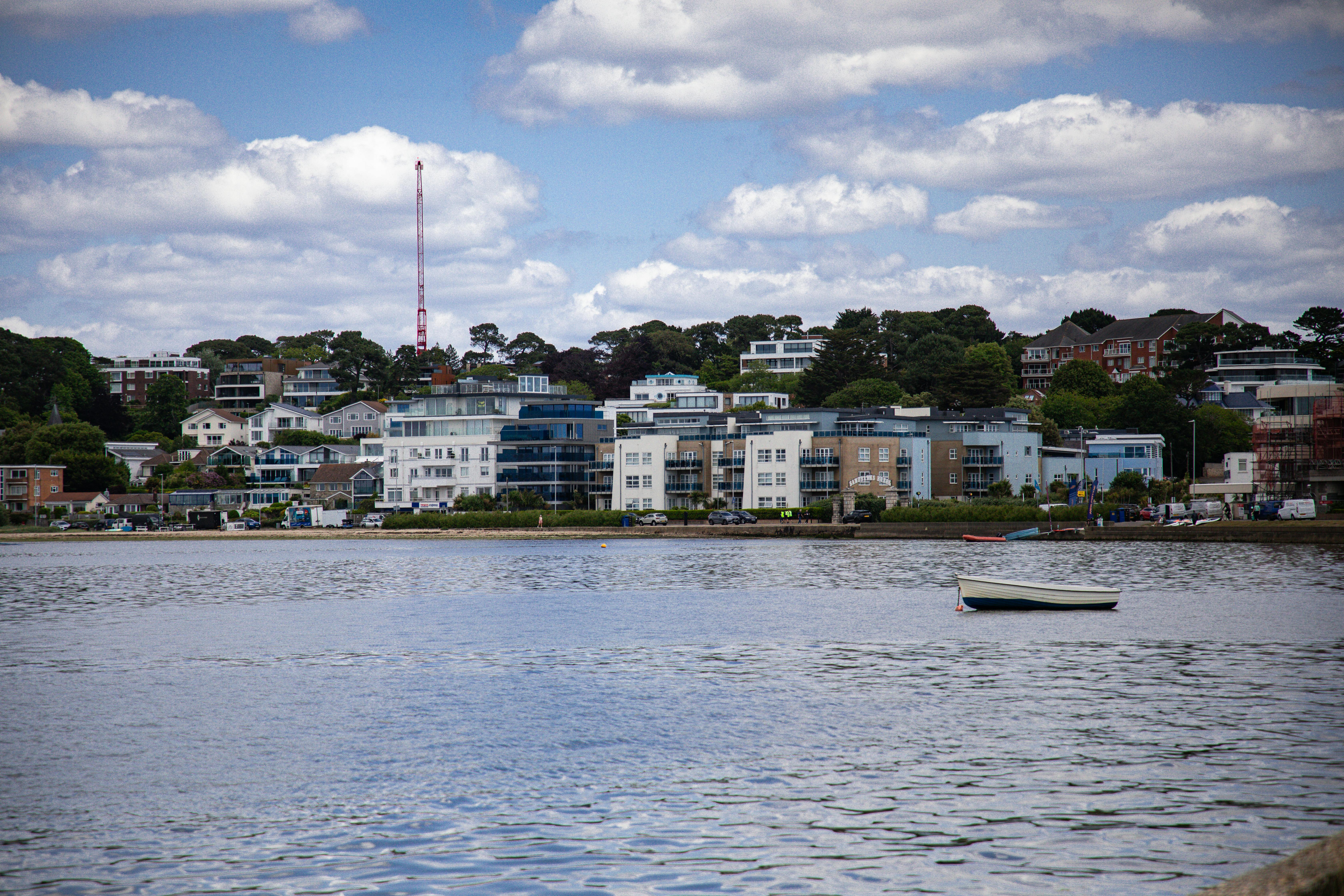 View of modern waterside architecture in Poole, England under blue skies.