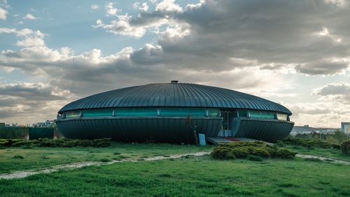 Free Modern circular building in Ankara, Türkiye, stands out against the cloudy sky, showcasing unique architectural design. Stock Photo
