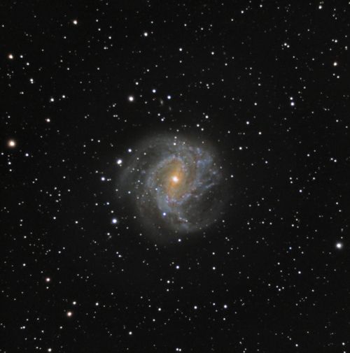 Free Explore the beauty of a spiral galaxy surrounded by countless stars in this breathtaking cosmic capture. Stock Photo