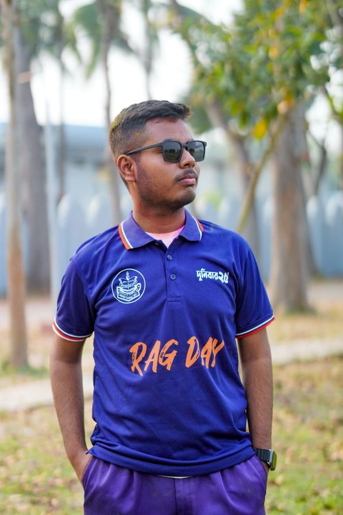 Guys Wearing Rag Young Man Wearing 'Rag Day' T-shirt Outdoors · Free Stock Photo