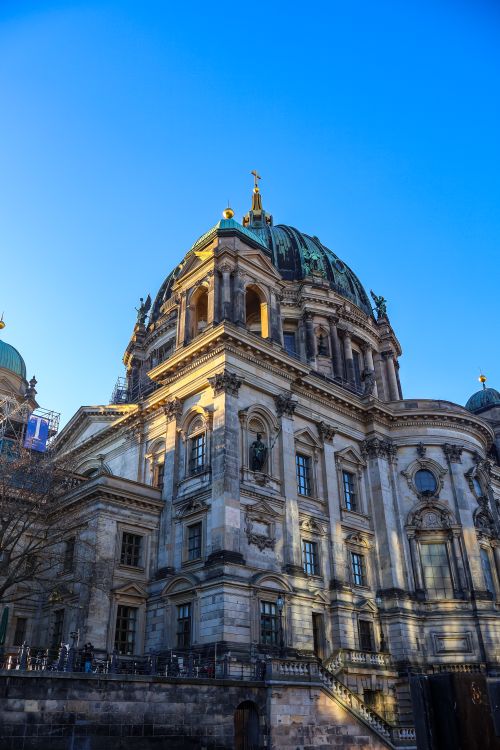 Free Berlin Cathedral against a clear blue sky, showcasing its neo-Renaissance architecture. Stock Photo
