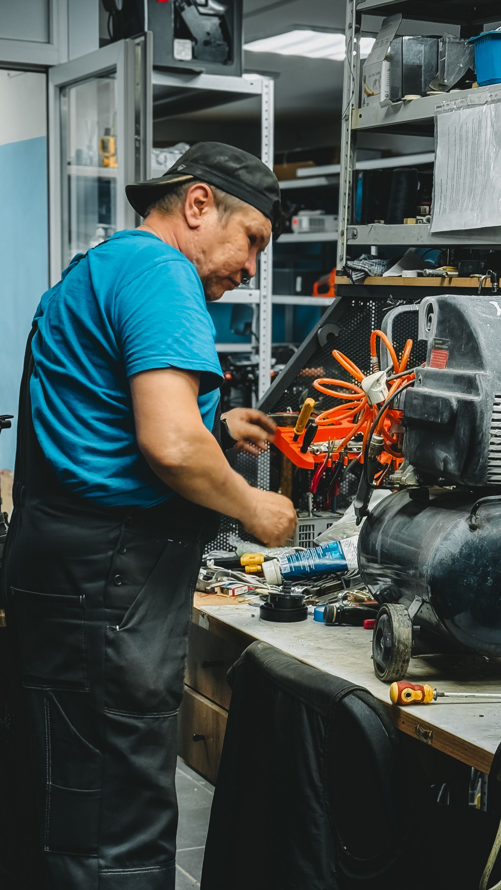 Mechanic and service advisor checking a repair order near the bay