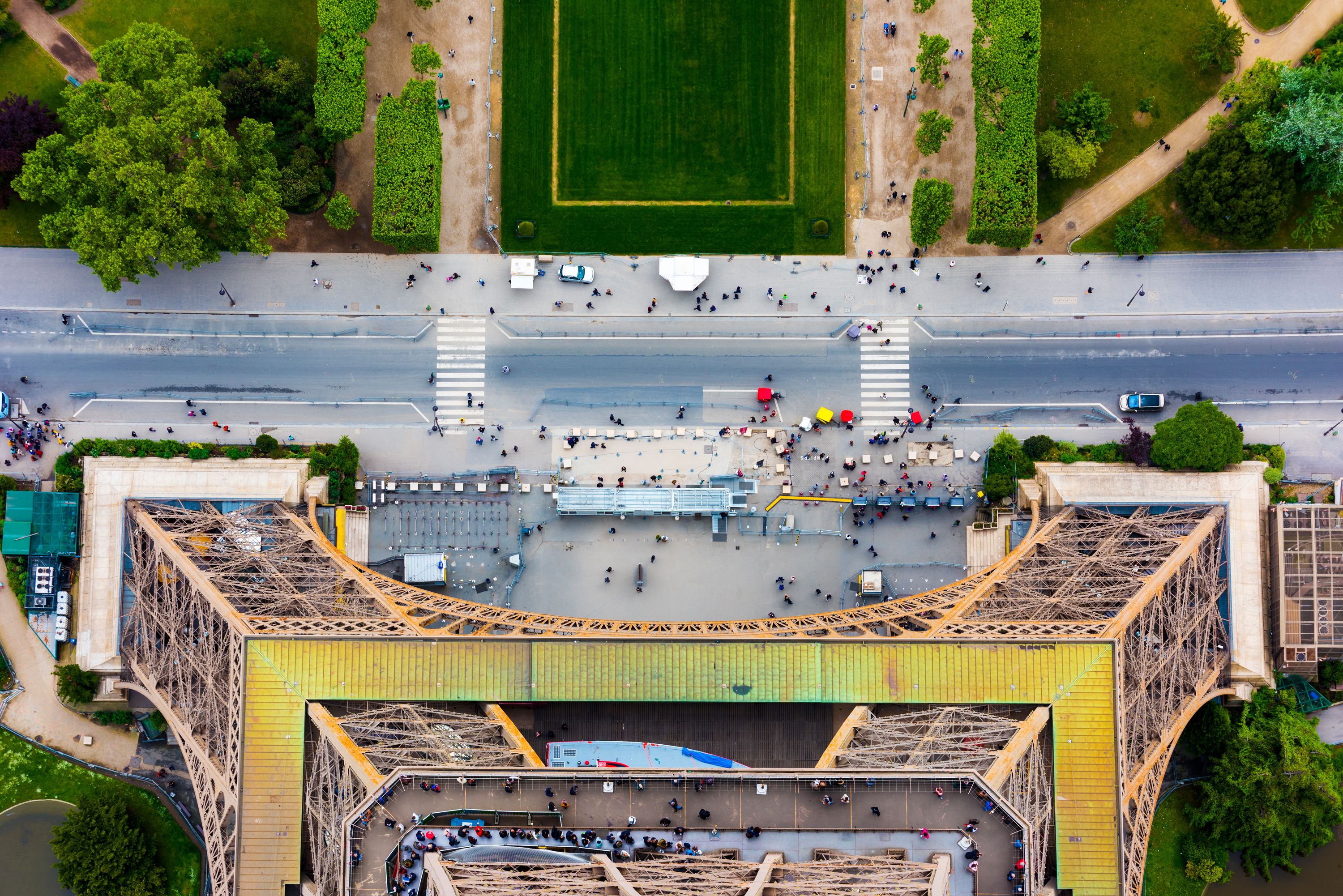 A vibrant aerial shot capturing the top view of the Eiffel Tower and surrounding Parisian landscape. A vibrant aerial shot capturing the top view of the Eiffel Tower and surrounding Parisian landscape.