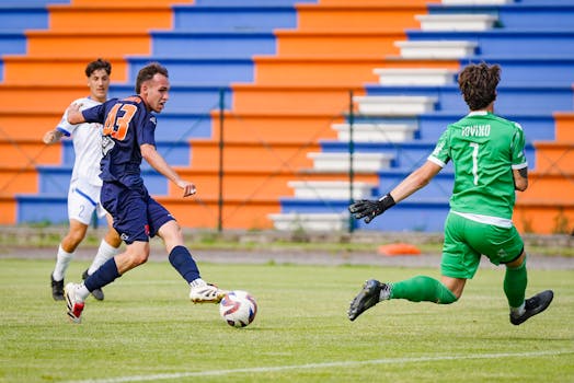 Exciting soccer scene featuring three players in action on the field during a daytime match.