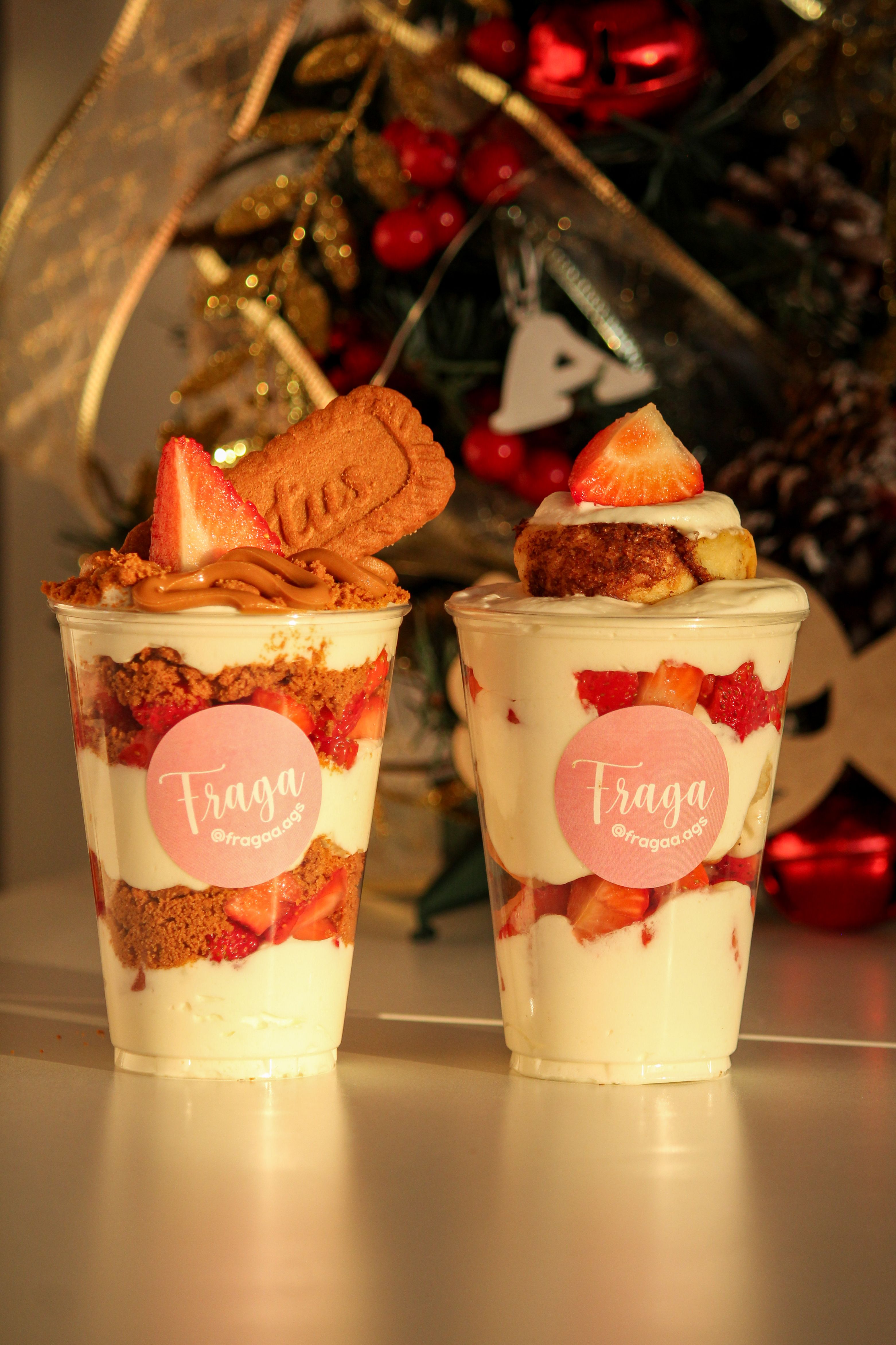 Delicious parfaits with strawberries, cookies, and cream, set against a festive background.