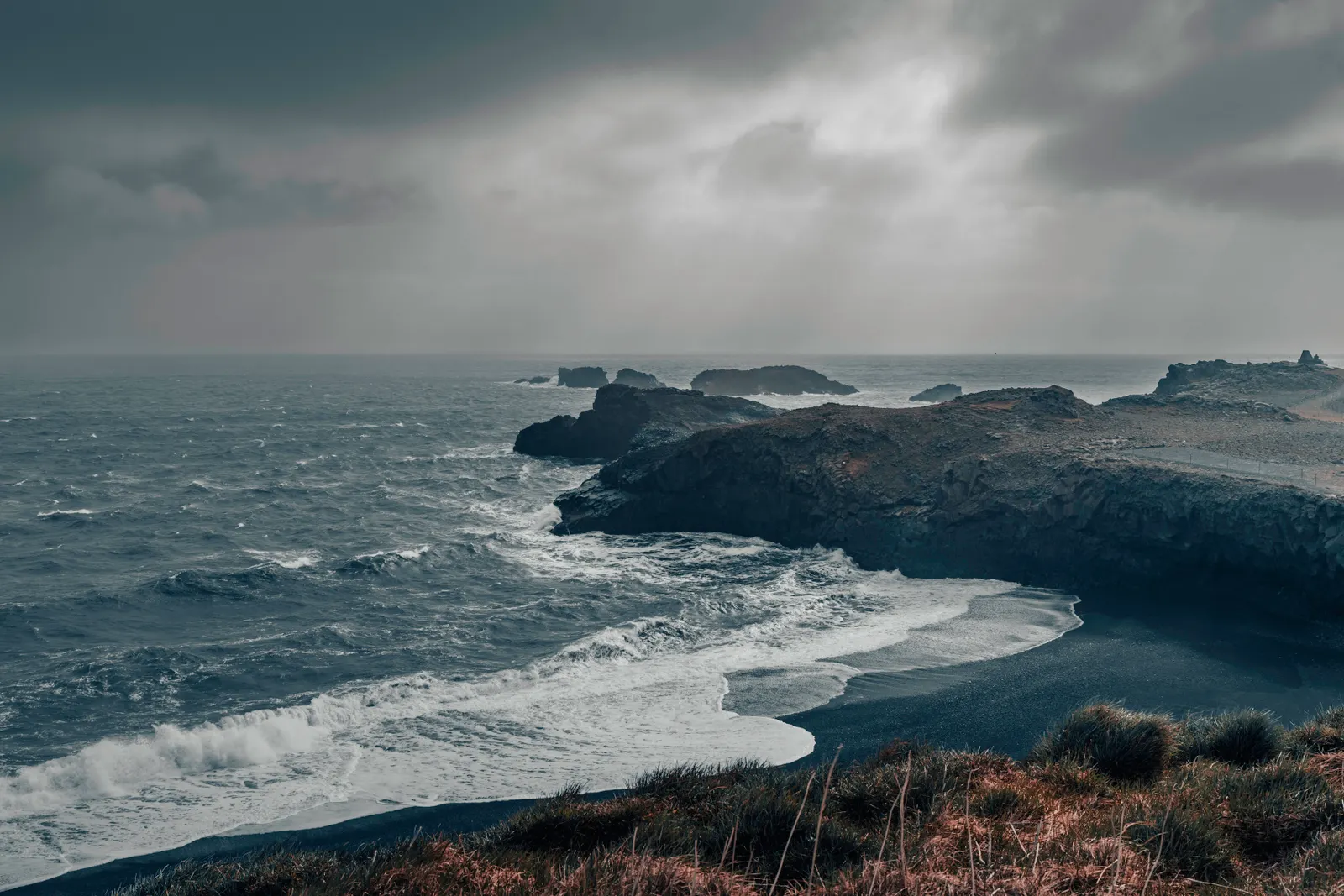 Moody Icelandic coastline with crashing waves