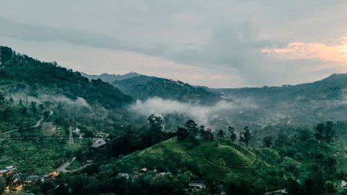 Free Captivating aerial view of lush green hills and misty skies in Sri Lanka's serene landscape. Stock Photo