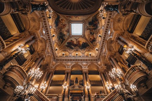 Free Stunning view of a grandiose, ornately decorated interior with spectacular ceiling art, columns, and chandeliers. Stock Photo