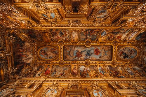 Free Stunning Baroque ceiling with intricate gold designs and classical paintings creating an opulent view. Stock Photo