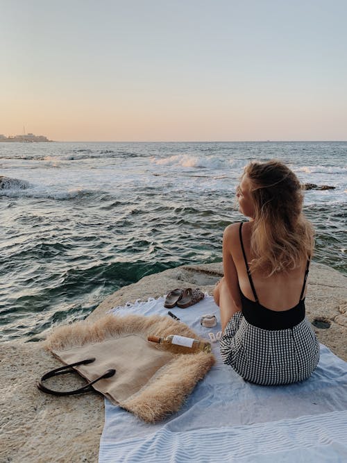 Woman in Black Spaghetti Strap Top in Front of Ocean