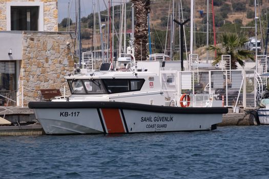 Sahil Güvenlik coast guard boat moored at Foça harbor, İzmir, Türkiye.