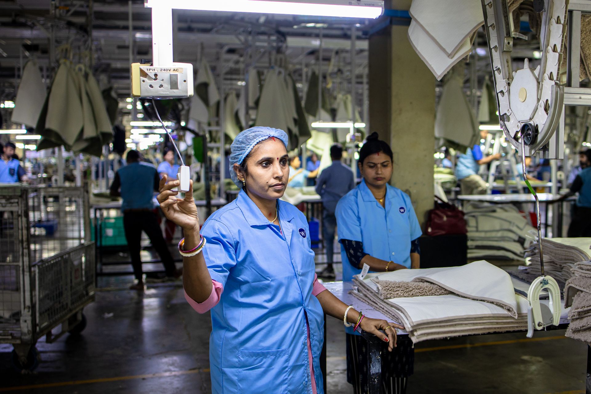 Women working in textile factory showcasing industrial labor and teamwork.