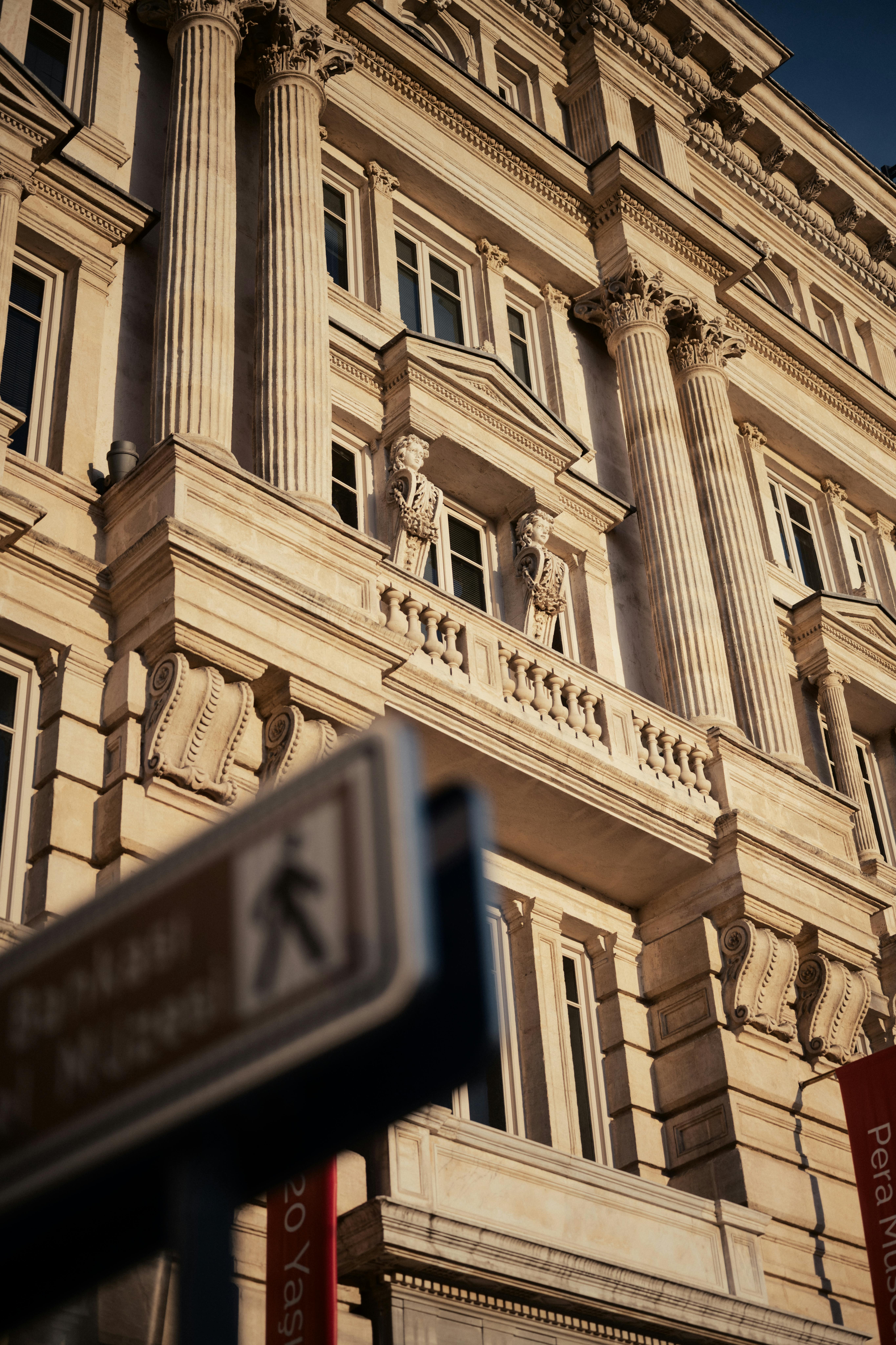Luxurious classical facade with Corinthian columns of Pera Museum in Istanbul during golden hour.