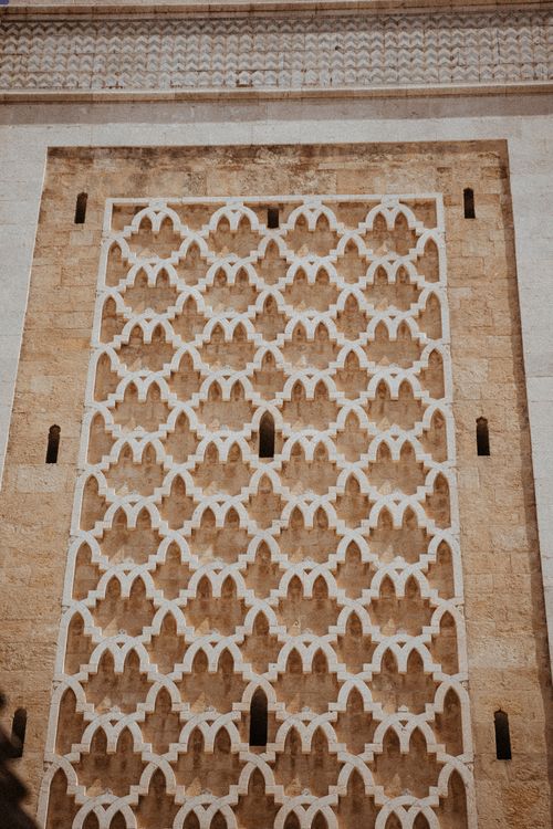 Free Close-up of detailed Islamic architectural pattern on a historic wall, showcasing geometric design. Stock Photo