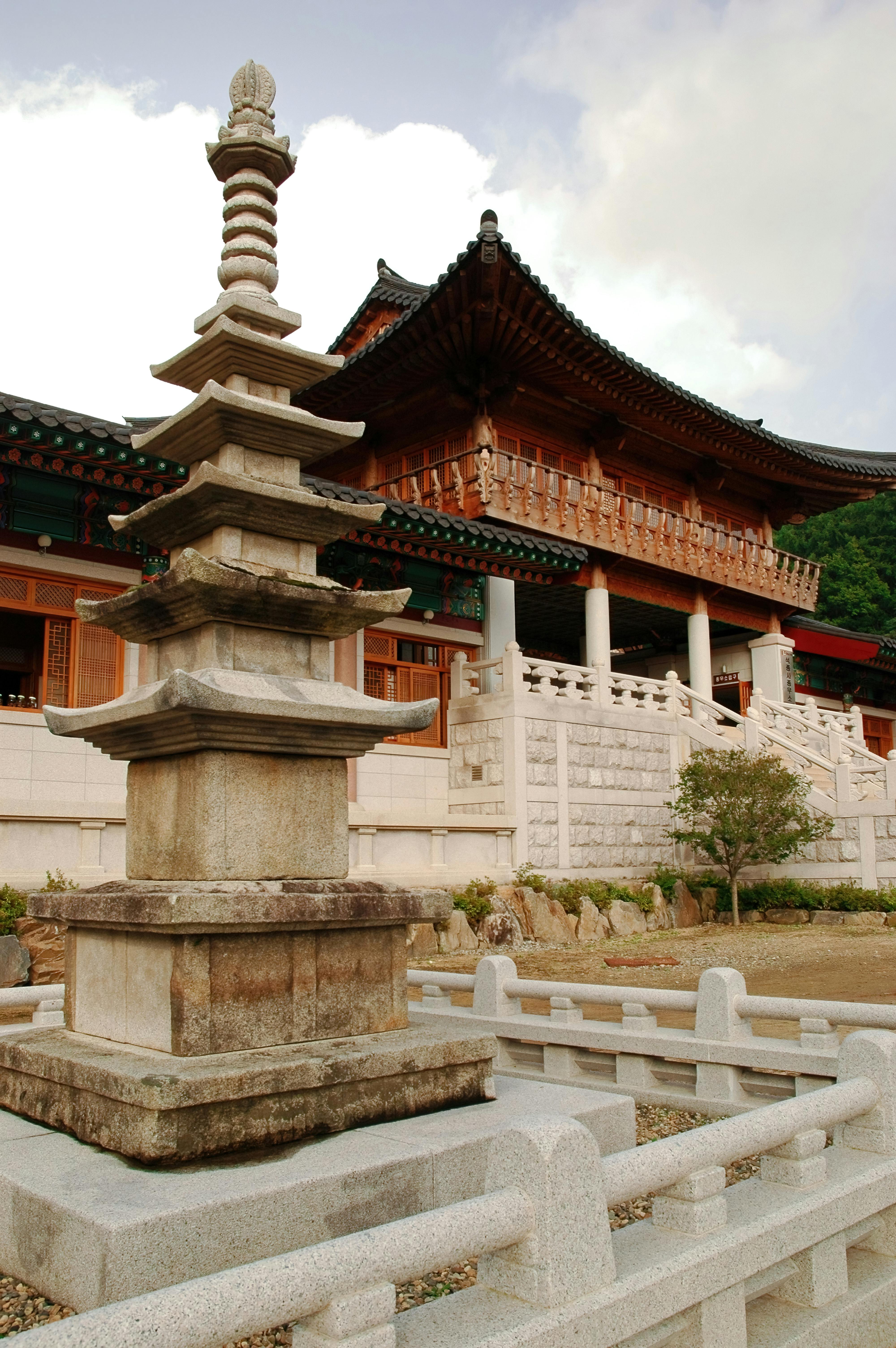 Serene Buddhist temple surrounded by mountains and green nature in Korea