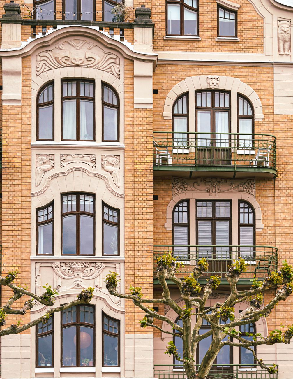 Detailed view of an Art Nouveau building façade in Lund, Sweden, showcasing intricate designs and balconies.. pexels, detaile