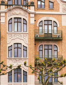Detailed view of an Art Nouveau building façade in Lund, Sweden, showcasing intricate designs and balconies.. pexels, detaile
