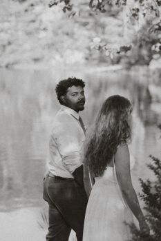 Ethereal candid moment of a couple by the lake in Mountain Rest.