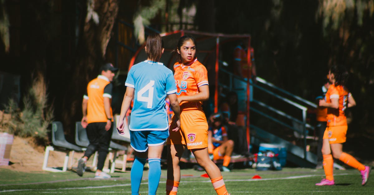 Action shot of a women's football match on a sunny day in Chile.