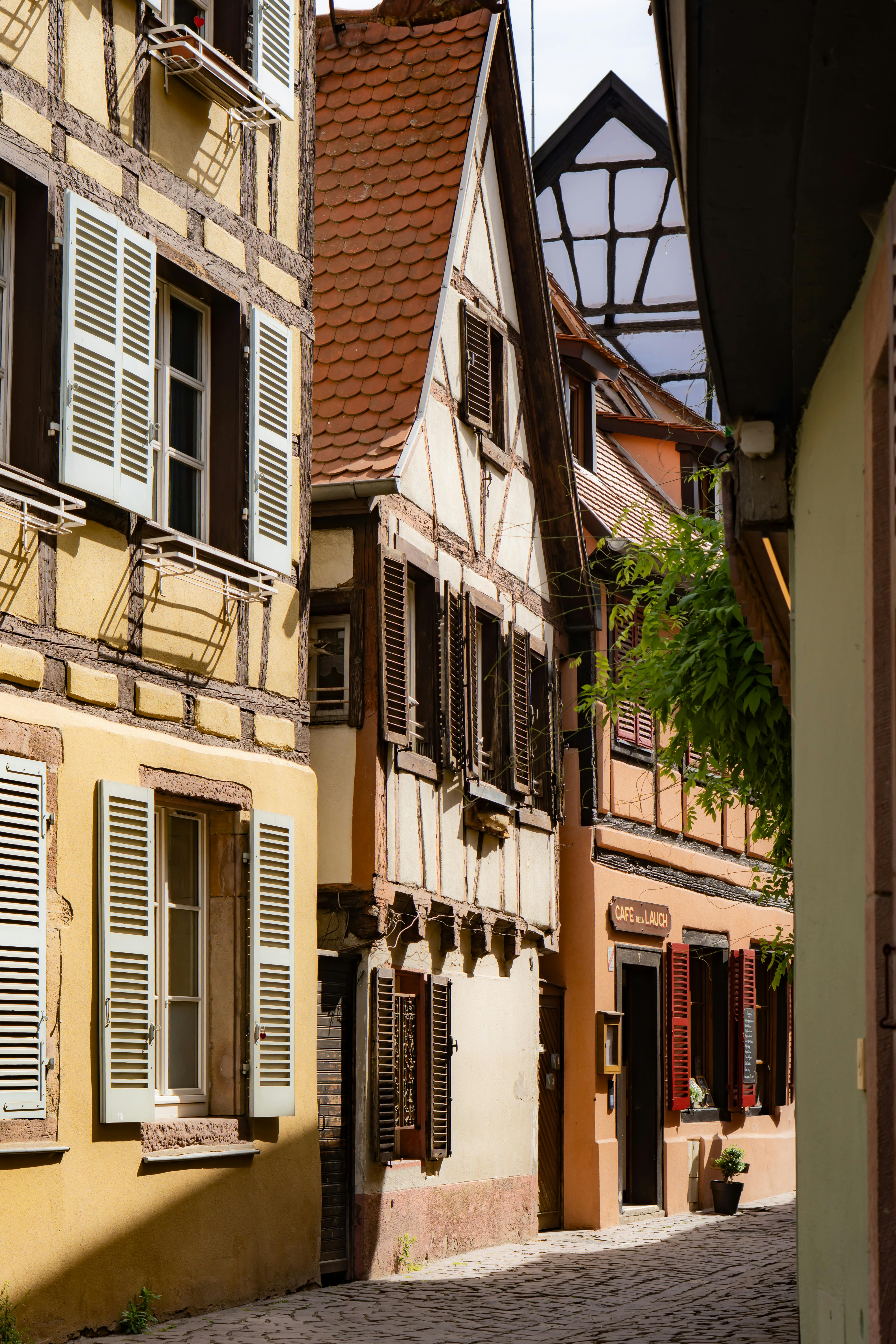 A picturesque street in Colmar showcasing traditional Alsatian architecture.