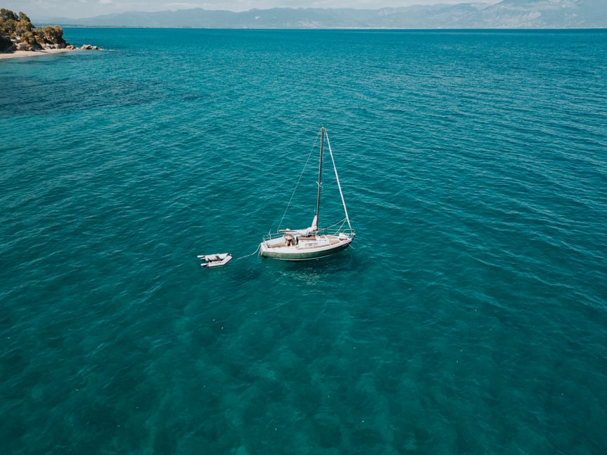 Stunning Full-Day Charter To The Baths Virgin Gorda British Virgin Islands Review 2026 - A peaceful sailboat on clear turquoise waters, perfect for a summer getaway.