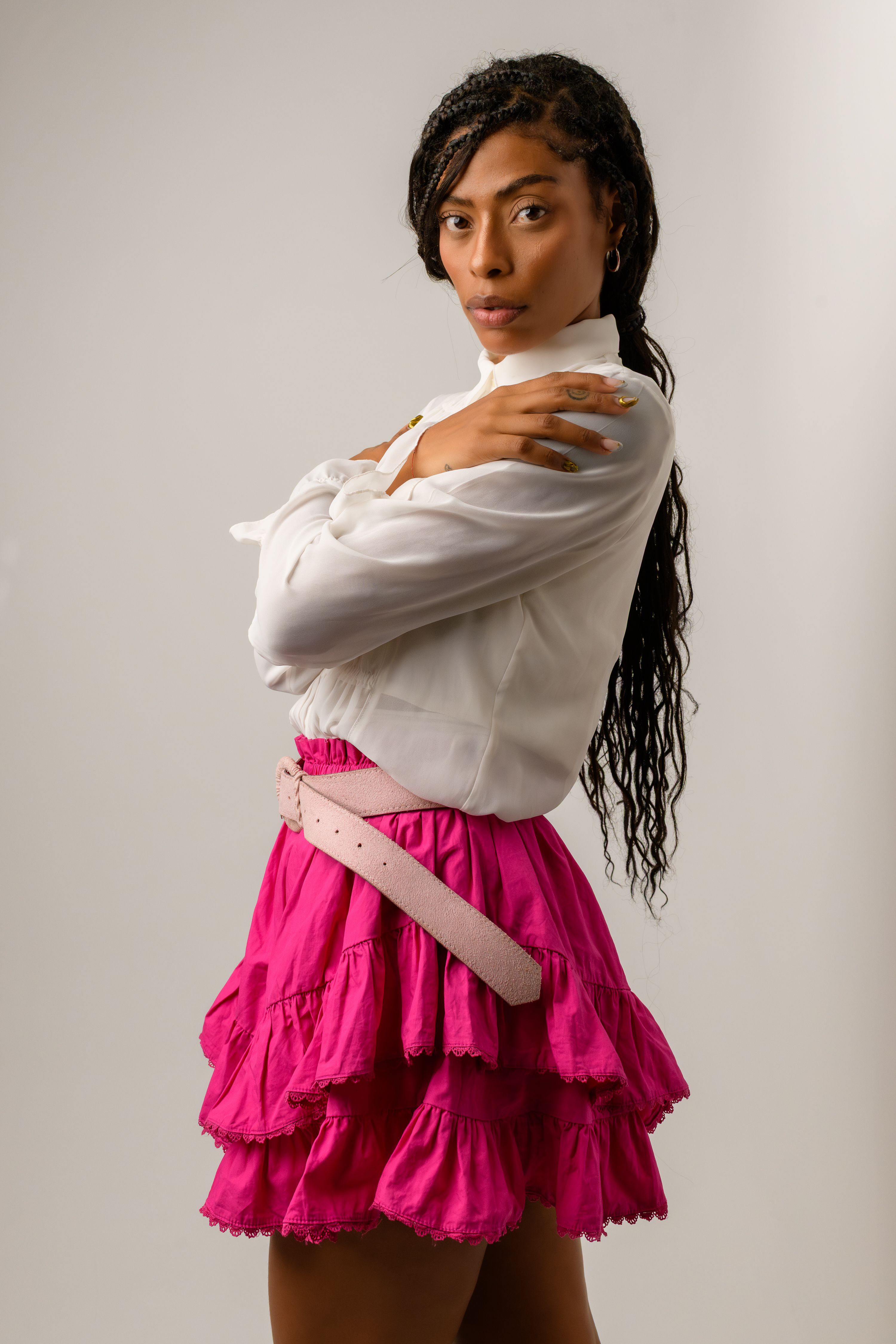 Woman wearing a ruffled mini skirt with a fitted top