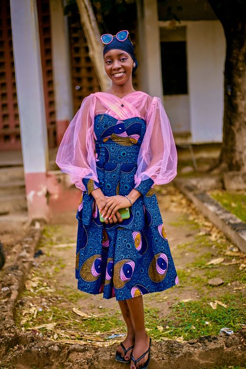 Young Woman in Vibrant Traditional Dress Outdoors · Free Stock Photo