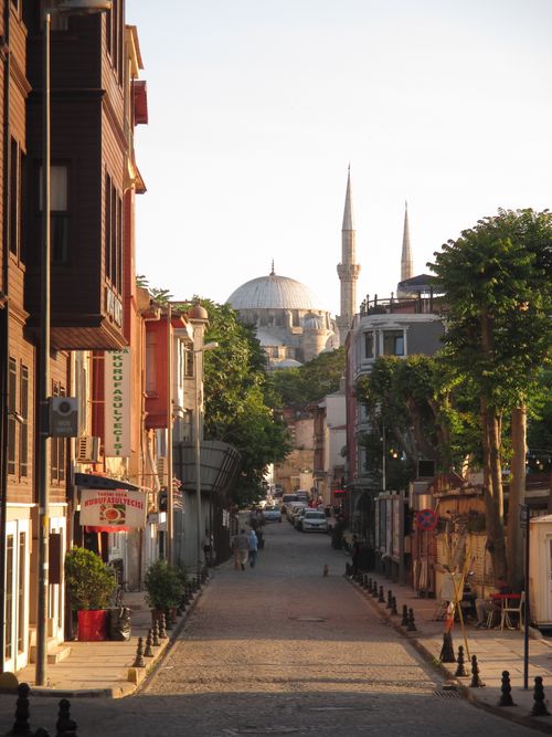 Free Explore the charm of Istanbul with a historic street view leading to a mosque at dusk. Stock Photo