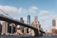 Brooklyn Bridge and NYC Skyline Under Blue Skies
