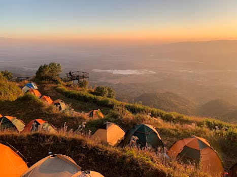 Tents overlooking stunning sunrise views in Pindaya, Myanmar's scenic landscapes.