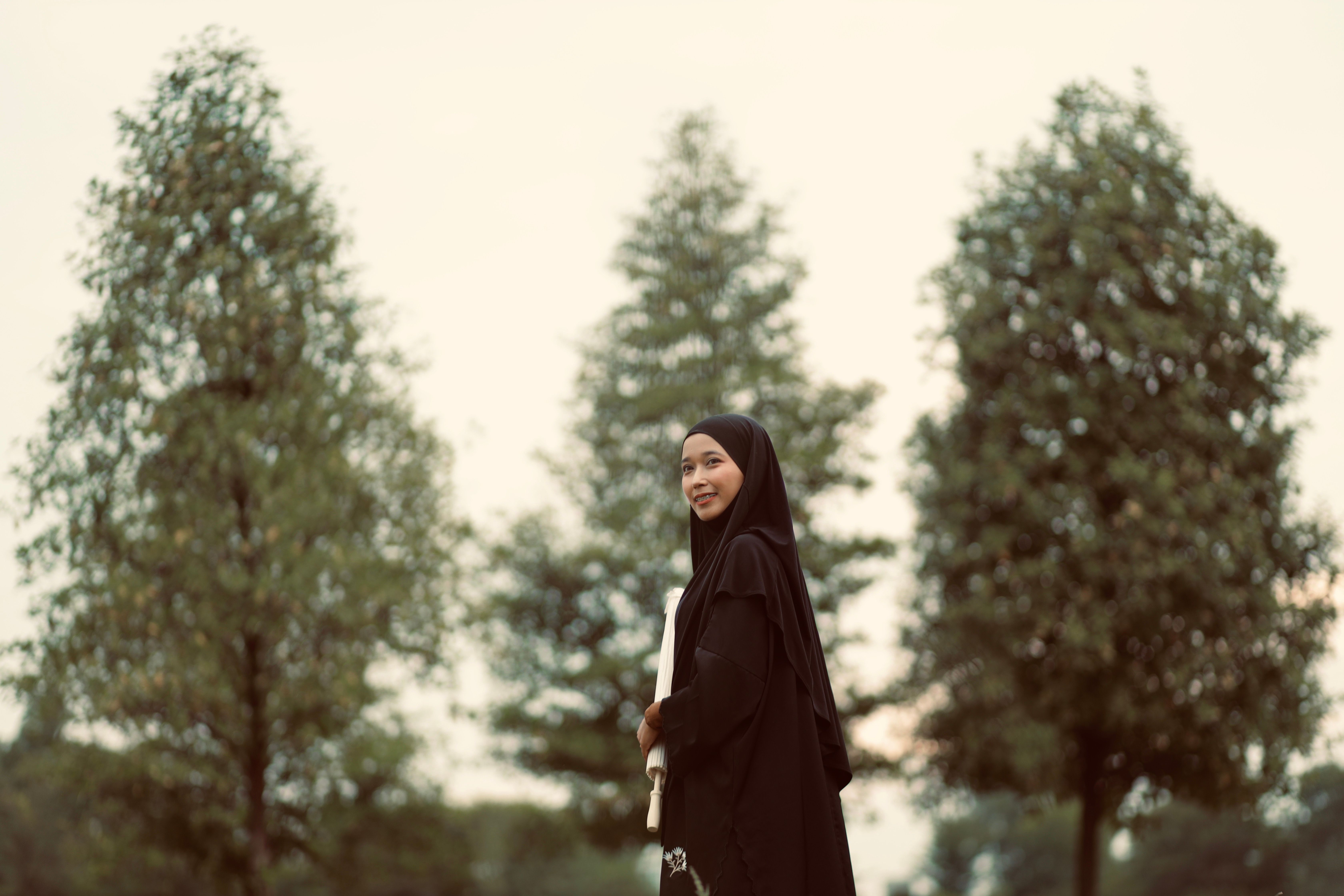 Young Woman in Black Hijab Outdoors in Nature · Free Stock Photo