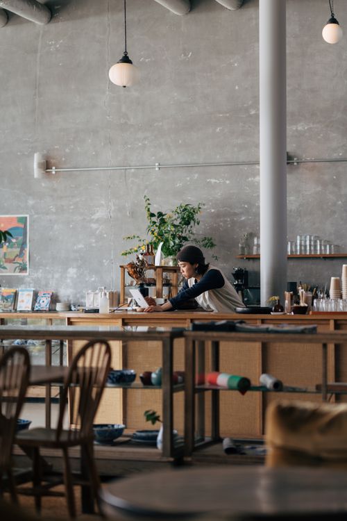Free Warm and inviting cafe setting with barista in Yokosuka, Japan. Stock Photo